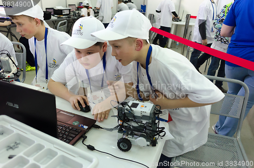 Image of School students program the robot. Tyumen. Russia
