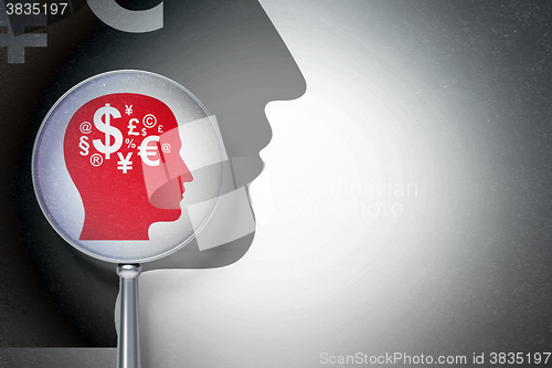 Image of Education concept:  Head With Finance Symbol with optical glass on digital background