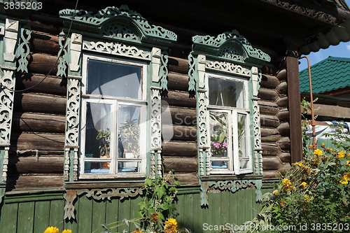 Image of carvings window log farmhouse 