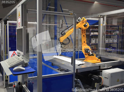 Image of  Industrial robotic arm in a factory