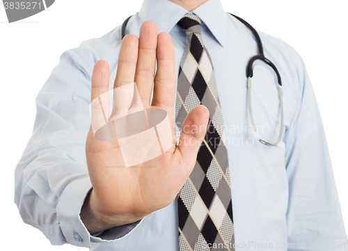 Image of Male doctor holding up his hand in a Halt or Stop gesture