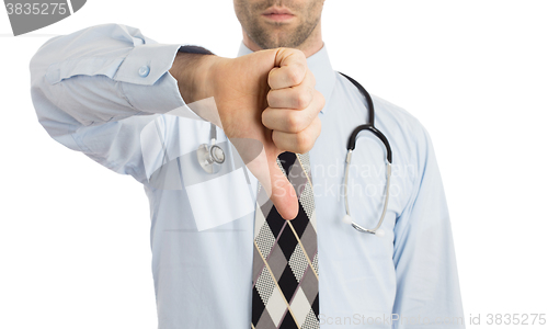 Image of Caucasian male doctor making a dislike gesture