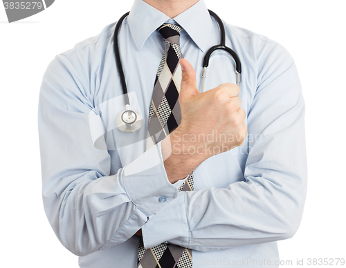 Image of Close up of male doctor hand showing thumbs up