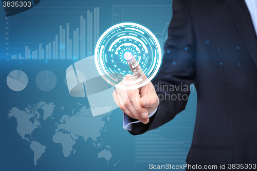 Image of  technology and internet concept - businessman pressing button with mechanism icon on virtual screens