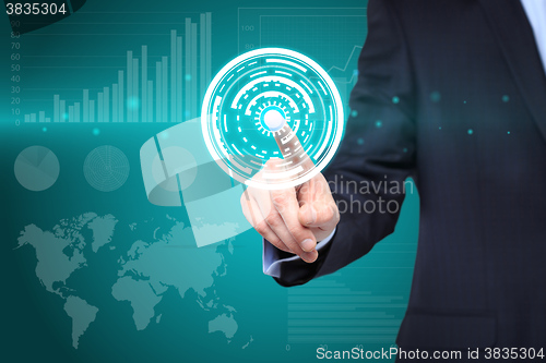 Image of  technology and internet concept - businessman pressing button with mechanism icon on virtual screens