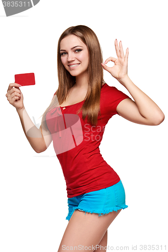 Image of Smiling girl showing red card in hand