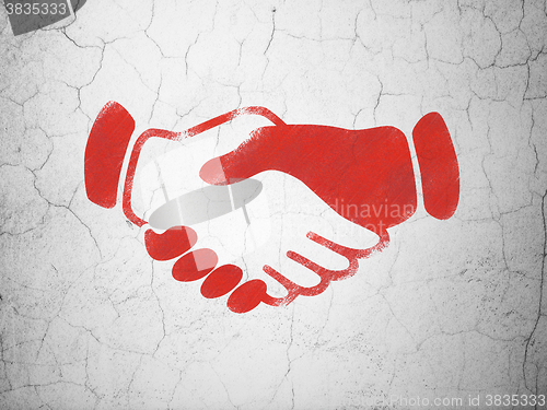 Image of Finance concept: Handshake on wall background