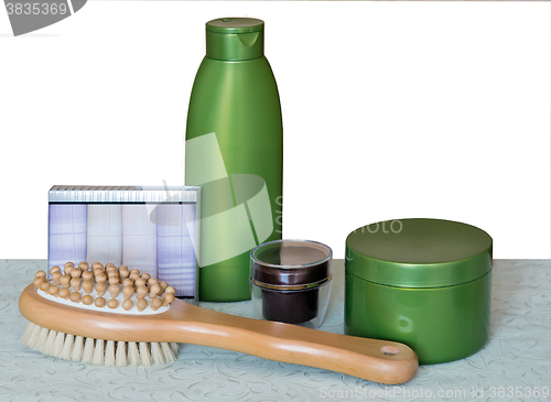 Image of Brush massage and cream for skin care.