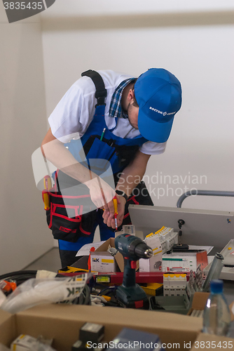 Image of Young electrician performs task of competition