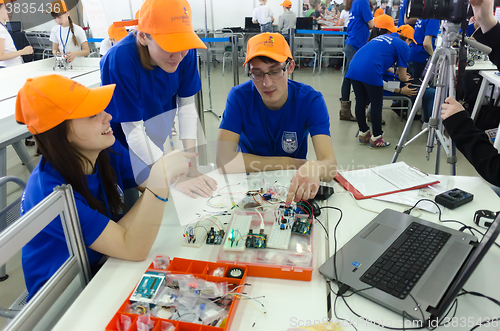 Image of students of college show electronic components