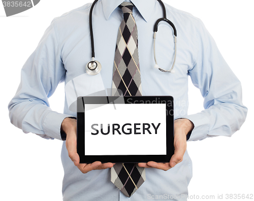 Image of Doctor holding tablet - Surgery