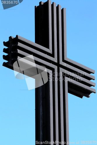 Image of black iron cross on a sky background