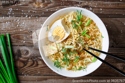 Image of Asian noodles with fresh green onion and boiled egg