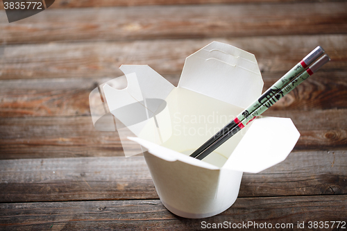 Image of Blank Chinese food container on old wood table