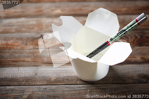 Image of Blank Chinese food container on old wood table