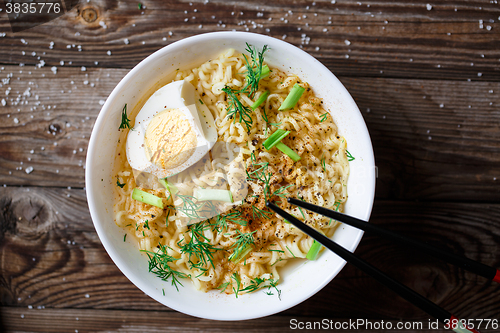 Image of Asian noodles with fresh green onion and boiled egg