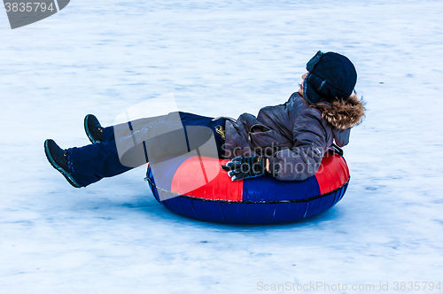 Image of Baby winter sledding on the Ural River