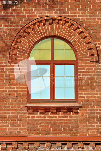 Image of A window on red wall.
