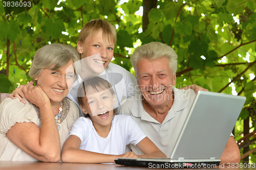 Image of Family with laptop