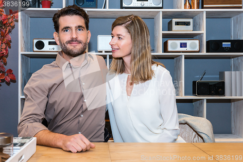 Image of Couple At Counter In Electronics Store