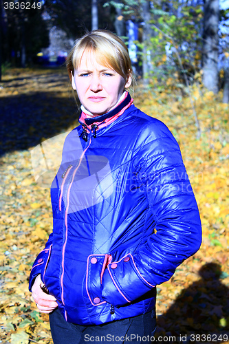 Image of modern fashionable woman in blue jacket