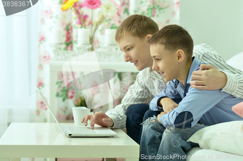 Image of Young boys and  laptop computer