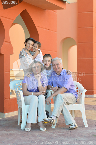 Image of Family relaxing at vacation resort