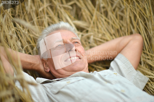 Image of Mature man enjoying on nature
