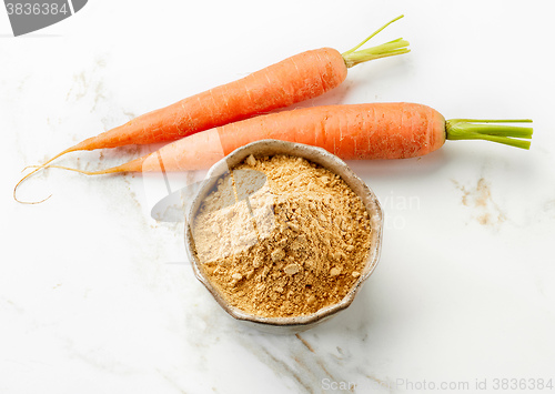 Image of bowl of dried carrot powder