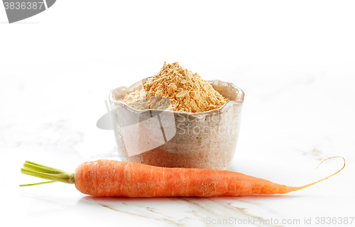 Image of bowl of dried carrot powder