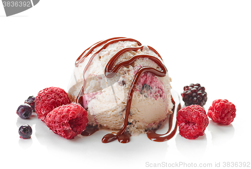 Image of Ice cream ball with chocolate sauce and frozen berries