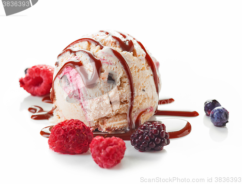 Image of Ice cream ball with chocolate sauce and frozen berries