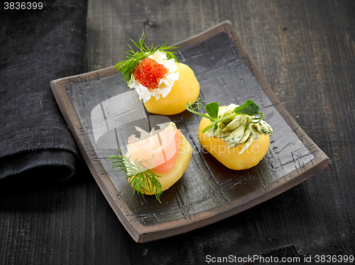 Image of decorated boiled potatoes on plate