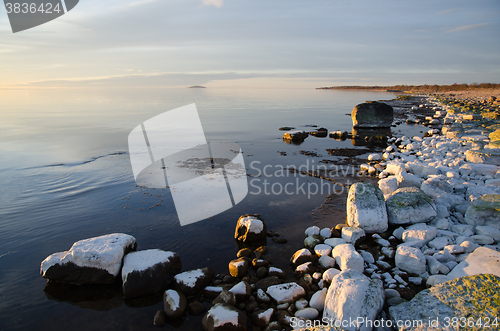 Image of Coastal view with contrasting colors and smooth water