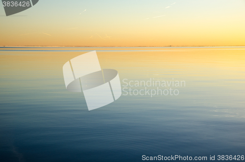 Image of Sunset colors by an absolute calm water