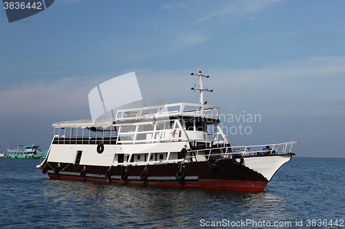 Image of old ship in blue ocean