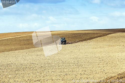 Image of tractor plowing the fields  