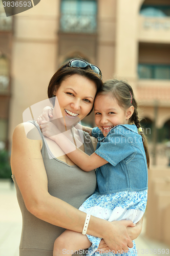 Image of Mother with  daughter near hotel