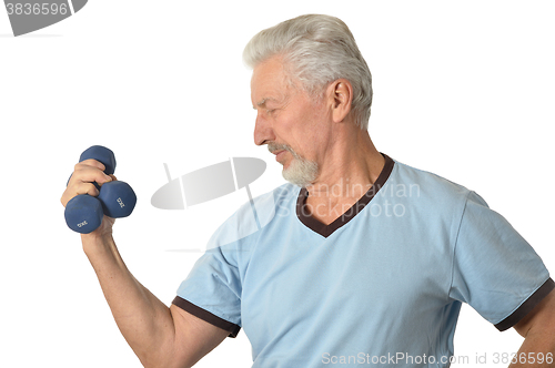 Image of Senior man Standing With Dumbbell