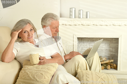 Image of Elderly people with tea and laptop