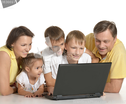 Image of family with laptop