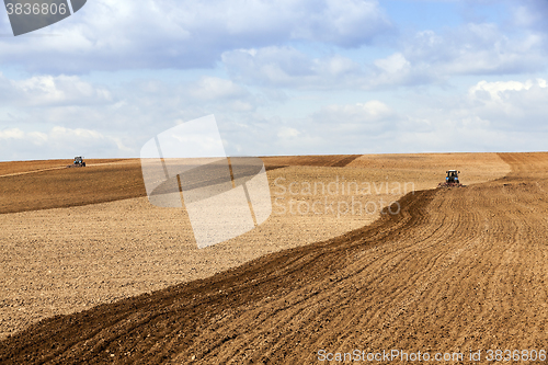 Image of tractor plowing the fields  