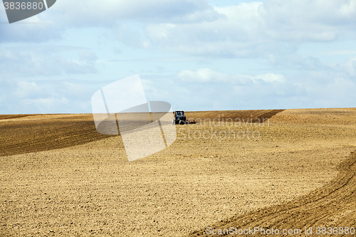 Image of tractor plowing field  
