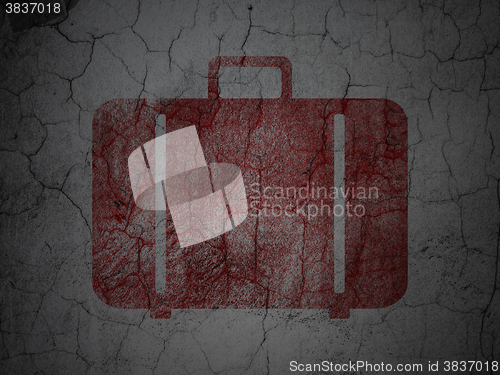 Image of Tourism concept: Bag on grunge wall background