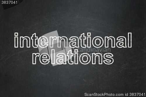 Image of Politics concept: International Relations on chalkboard background