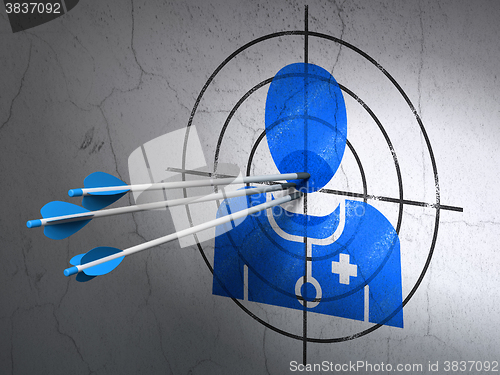 Image of Health concept: arrows in Doctor target on wall background