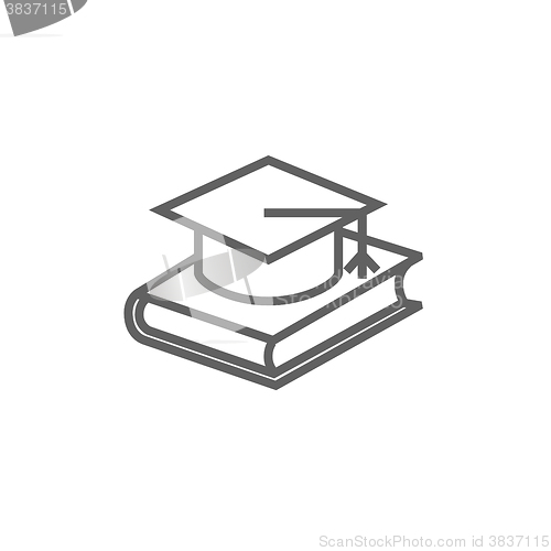 Image of Graduation cap laying on book line icon.