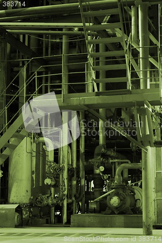 Image of Pipes and tubes and chimney at a power plant