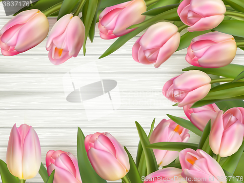 Image of Pink Tulips over wooden table. EPS 10