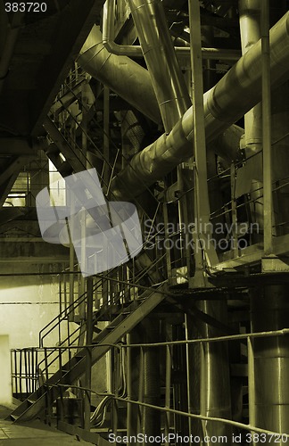Image of assortment of different size and shaped pipes at a power plant